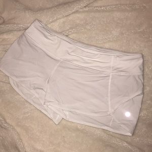 NEVER WORN white lululemon “speed up” shorts